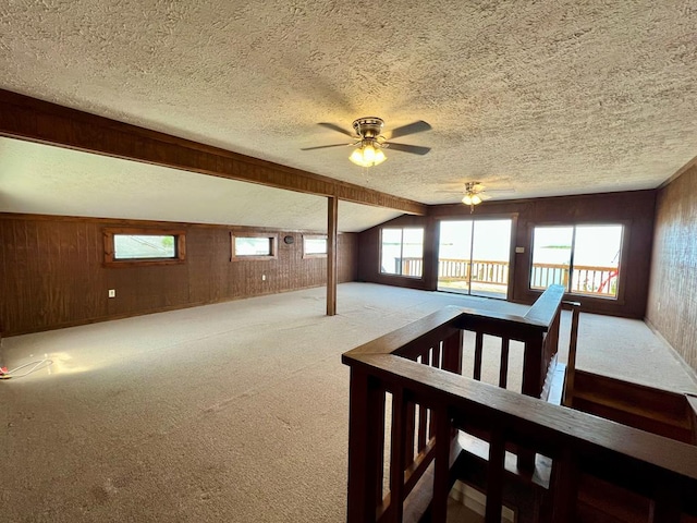 59 Judith Sound Cir, Lottsburg, VA 22511 - carpeted spare room with wood walls, a textured ceiling, and ceiling fan