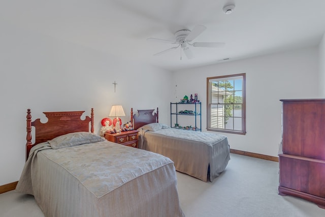 bedroom with light carpet and ceiling fan