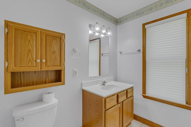 bathroom featuring tile patterned floors, vanity, and toilet