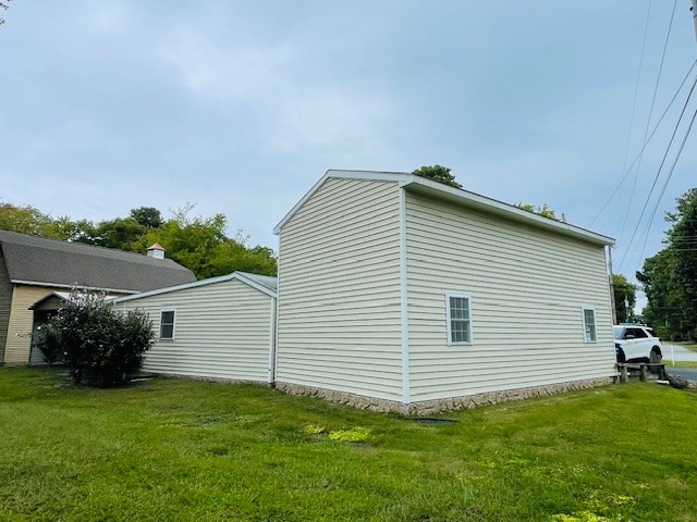 view of home's exterior featuring a yard