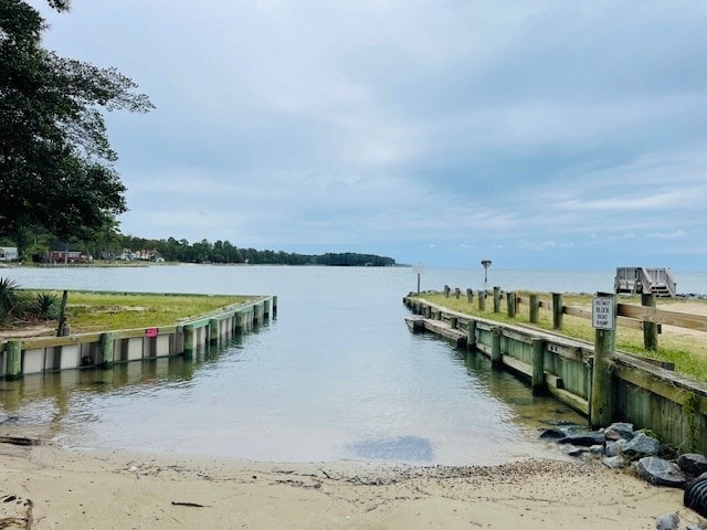 dock area with a water view