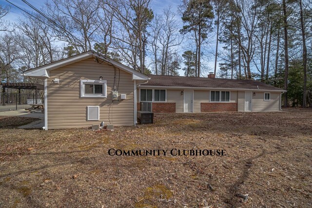 59 Hickory Rd, Lancaster, VA 22503 - back of house with a chimney