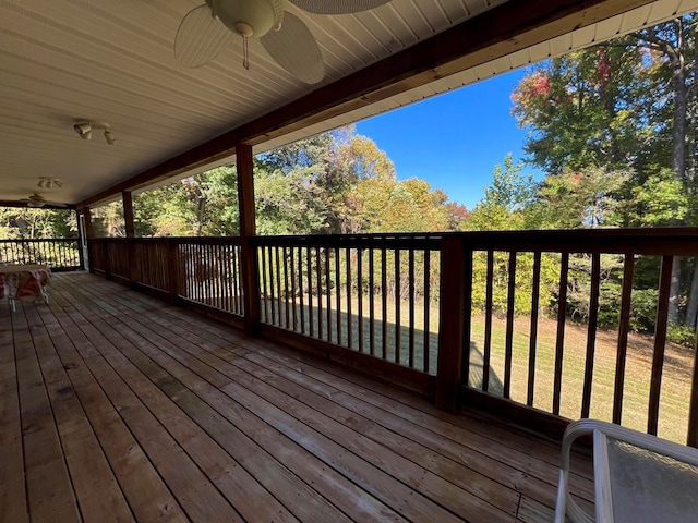 wooden terrace featuring ceiling fan