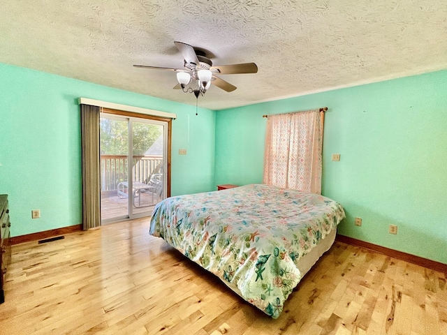 bedroom with access to outside, ceiling fan, and wood-type flooring