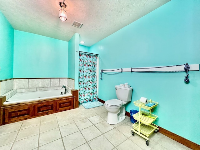 bathroom with tile patterned flooring, a textured ceiling, toilet, and separate shower and tub