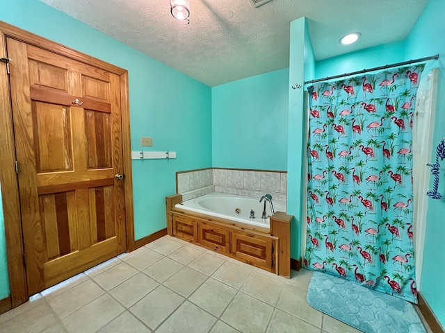 bathroom featuring tile patterned floors, a textured ceiling, and independent shower and bath