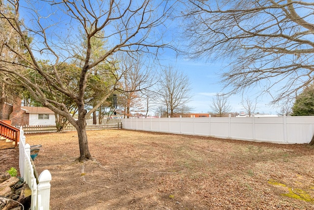 view of yard with a fenced backyard