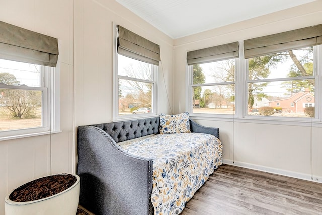 sitting room featuring plenty of natural light, baseboards, and wood finished floors