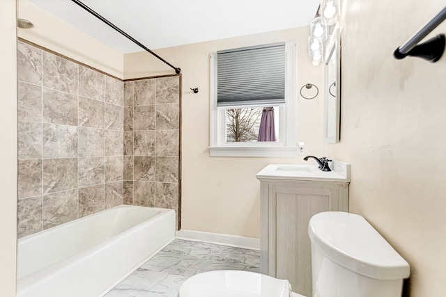 full bathroom featuring baseboards, toilet,  shower combination, marble finish floor, and vanity