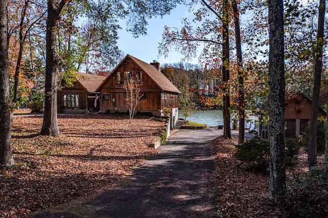 view of front of home with a water view