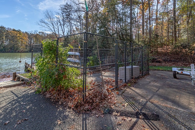 view of gate featuring a water view