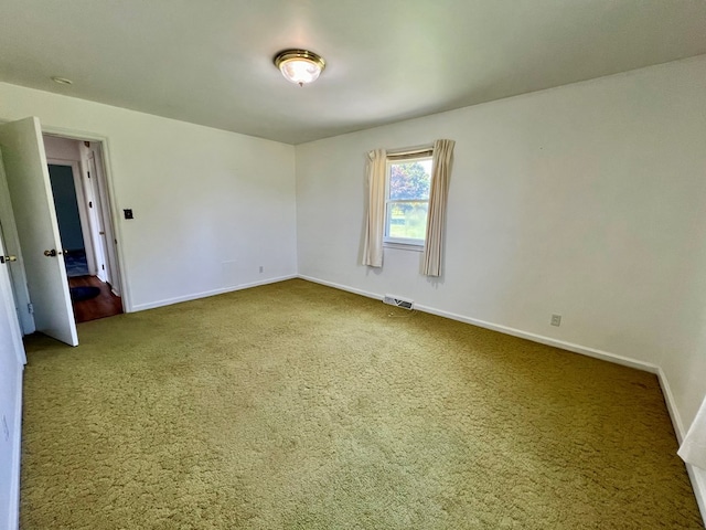 spare room featuring carpet flooring