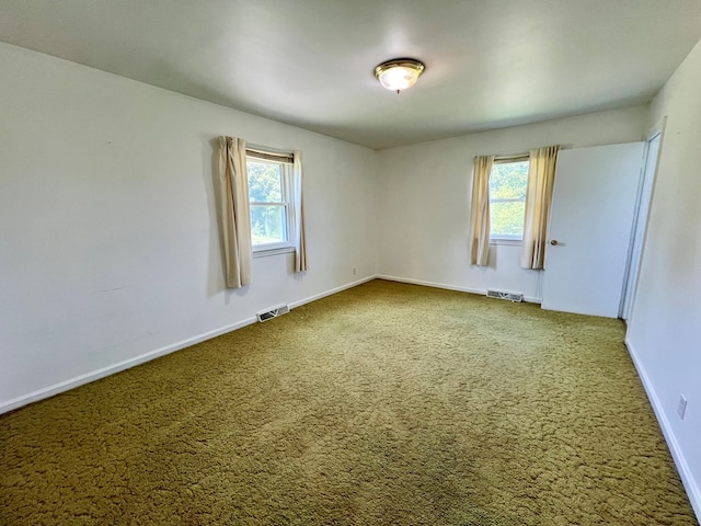 unfurnished room featuring carpet