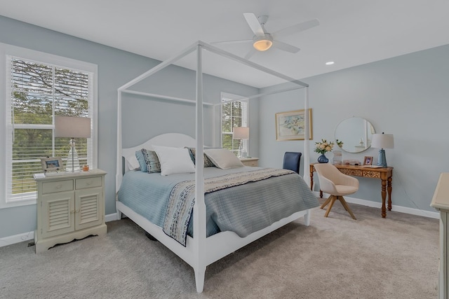 bedroom with light colored carpet and ceiling fan