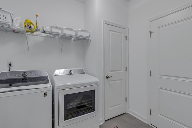 laundry room featuring washing machine and clothes dryer