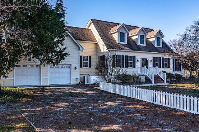 new england style home with a garage