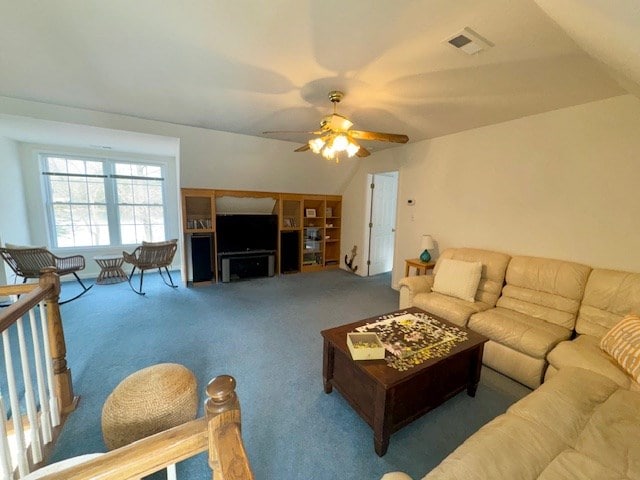 carpeted living area with a ceiling fan and visible vents