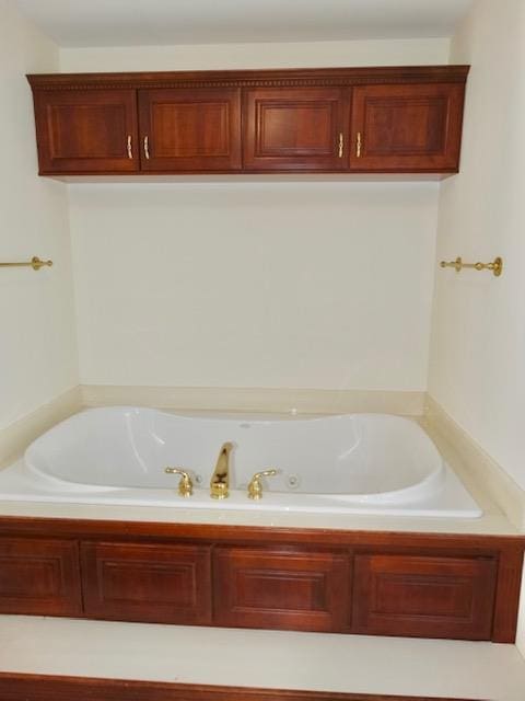 bathroom with a garden tub