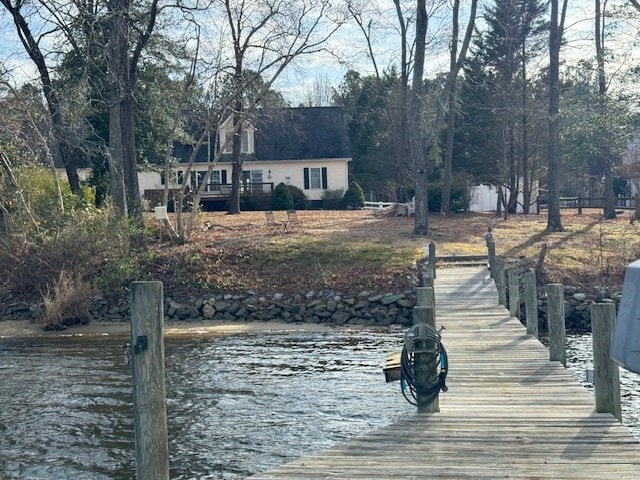 dock area featuring a water view