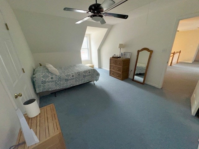 carpeted bedroom featuring a ceiling fan and lofted ceiling