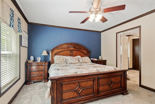 bedroom featuring a ceiling fan, baseboards, light carpet, and ornamental molding