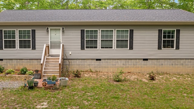ranch-style house featuring a shingled roof, a front yard, crawl space, and entry steps