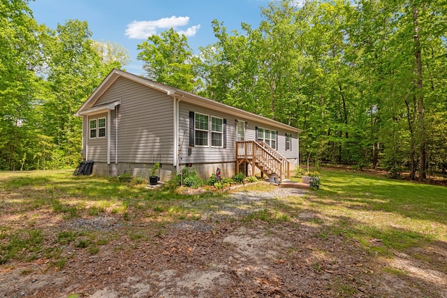 view of side of property with a yard