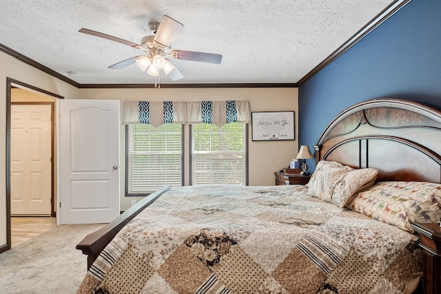 bedroom featuring crown molding, a textured ceiling, carpet, and ceiling fan