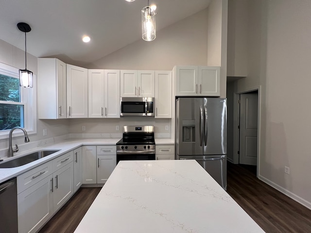 605 Shorewood Dr, Colonial Beach, VA 22443 - kitchen featuring stainless steel appliances, a sink, dark wood-type flooring, high vaulted ceiling, and light stone counters