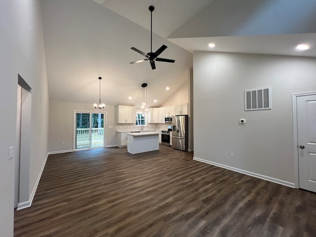 605 Shorewood Dr, Colonial Beach, VA 22443 - unfurnished living room featuring high vaulted ceiling, dark wood-type flooring, a ceiling fan, recessed lighting, and a chandelier