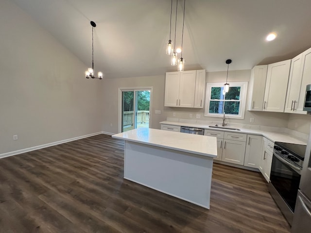 605 Shorewood Dr, Colonial Beach, VA 22443 - kitchen featuring a sink, stainless steel appliances, vaulted ceiling, a kitchen island, and light countertops