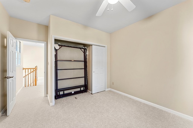 341 Pine Reach Dr, Kilmarnock, VA 22482 - unfurnished bedroom featuring baseboards, ceiling fan, a closet, and light colored carpet