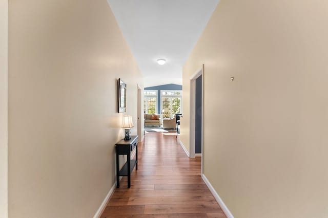 341 Pine Reach Dr, Kilmarnock, VA 22482 - hall featuring hardwood / wood-style floors, lofted ceiling, and baseboards