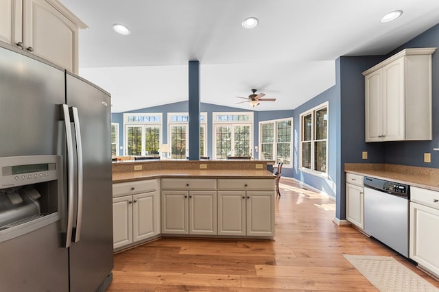 341 Pine Reach Dr, Kilmarnock, VA 22482 - kitchen featuring light wood finished floors, a ceiling fan, dishwashing machine, stainless steel fridge with ice dispenser, and vaulted ceiling