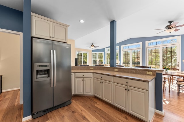 341 Pine Reach Dr, Kilmarnock, VA 22482 - kitchen with a peninsula, stainless steel refrigerator with ice dispenser, light wood-style floors, and a ceiling fan