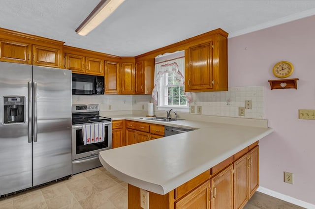 15 Surry St, Ophelia, VA 22473 - kitchen featuring stainless steel appliances, a sink, a peninsula, tasteful backsplash, and light countertops