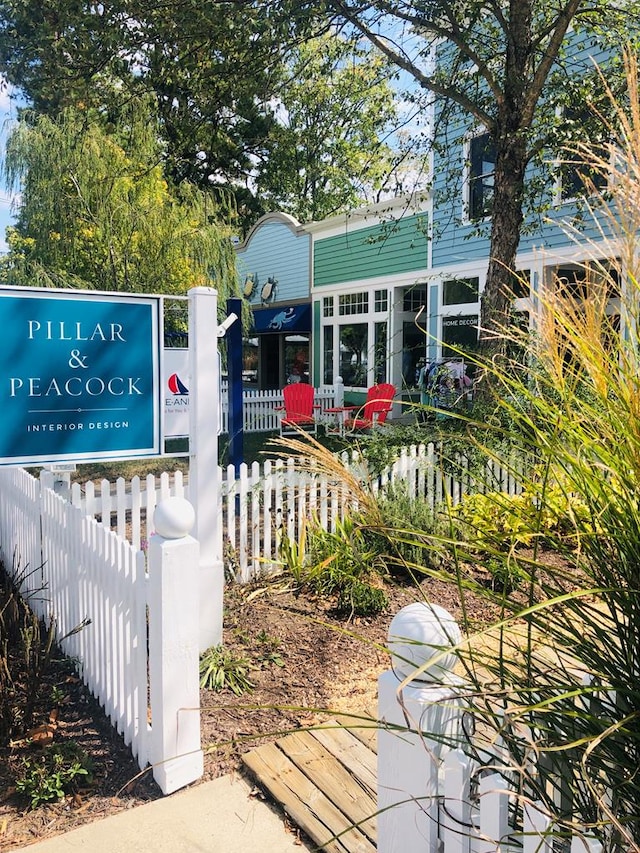 surrounding community with a fenced front yard