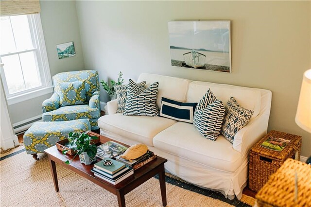 living area featuring a baseboard heating unit