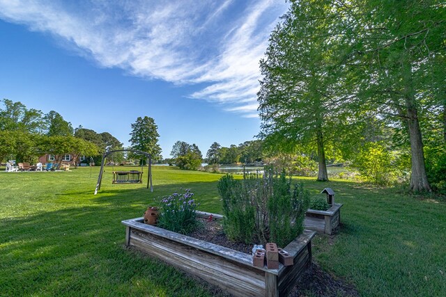 view of property's community with a lawn