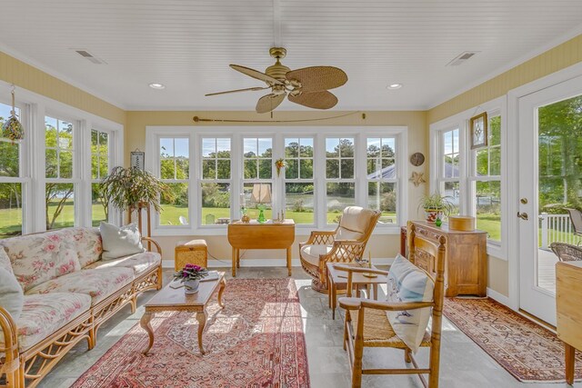 sunroom / solarium featuring french doors, ornamental molding, baseboards, and visible vents