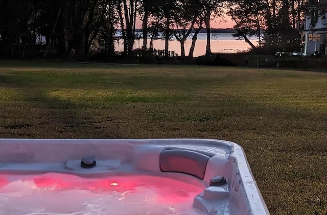 yard at dusk with a water view