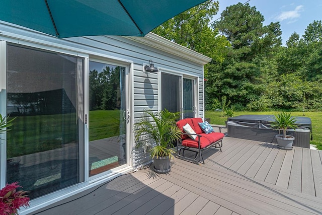 wooden terrace featuring a covered hot tub