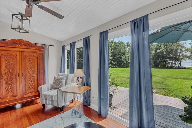 entryway with hardwood / wood-style floors, a healthy amount of sunlight, and lofted ceiling