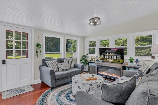 sunroom featuring plenty of natural light and lofted ceiling