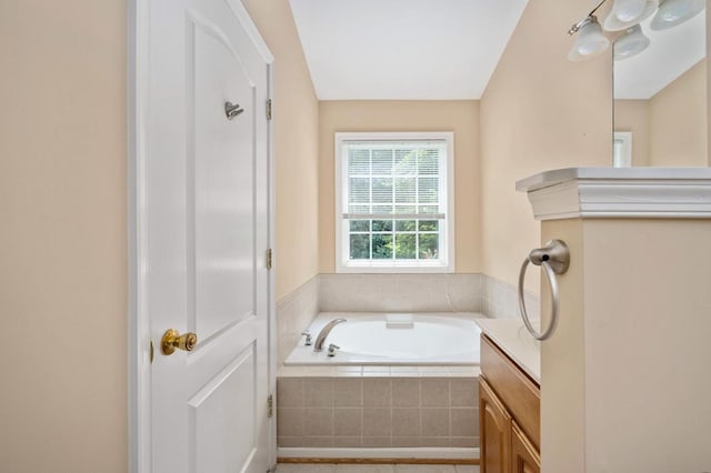 bathroom with tiled bath and vaulted ceiling