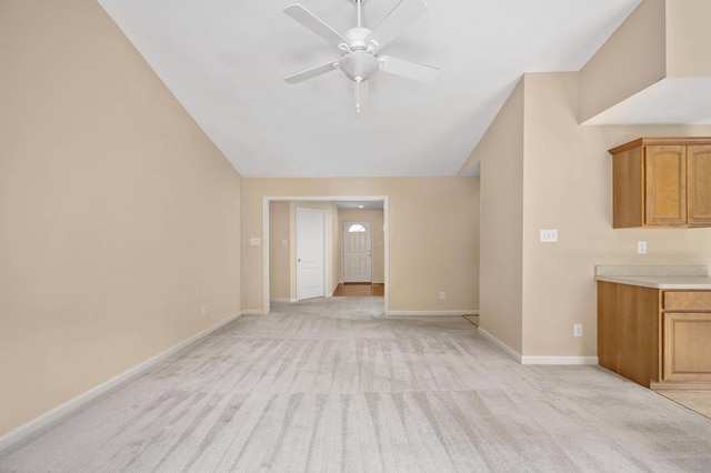 unfurnished living room with light carpet and ceiling fan