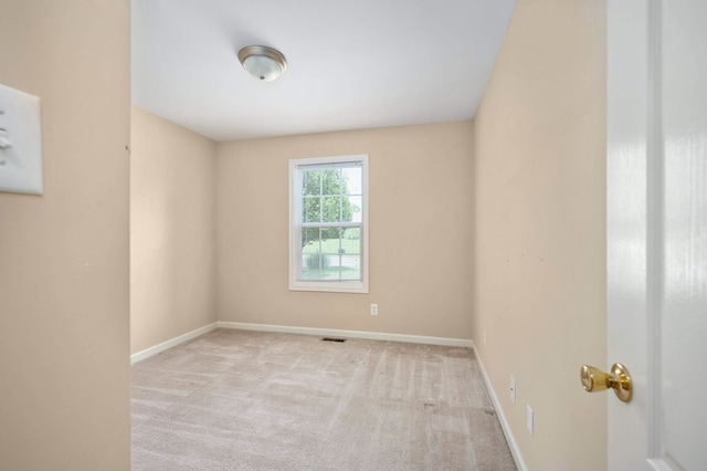 empty room with light colored carpet