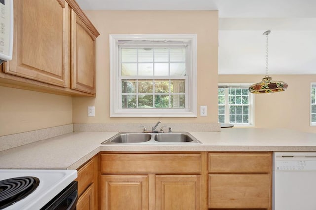 kitchen with light brown cabinetry, sink, white dishwasher, and pendant lighting