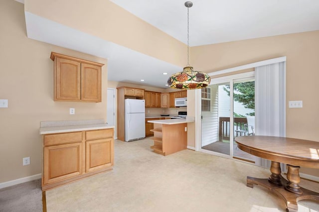 kitchen featuring light brown cabinetry, white appliances, and hanging light fixtures