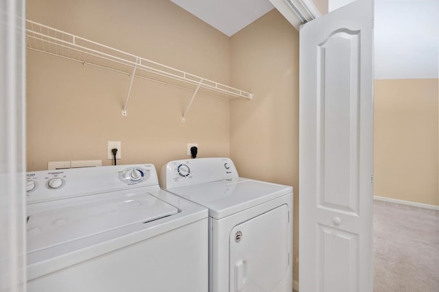 washroom featuring washer and dryer and carpet flooring